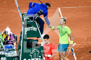 2022-06-01 - Rafael Nadal of Spain and Novak Djokovic of Serbia shake hands during the French Open semifinal, Grand Slam tennis tournament on May 31, 2022 at Roland-Garros stadium in Paris, France - TENNIS - ROLAND GARROS 2022 - WEEK 2 - INTERNATIONALS - TENNIS