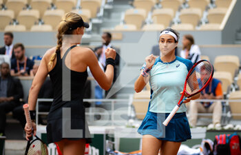 2022-06-05 - Kristina Mladenovic of France & Caroline Garcia of France in action during the doubles final of the Roland-Garros 2022, Grand Slam tennis tournament on June 5, 2022 at Roland-Garros stadium in Paris, France - TENNIS - ROLAND GARROS 2022 - WEEK 2 - INTERNATIONALS - TENNIS