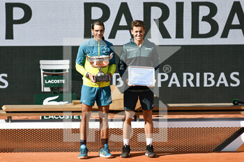 2022-06-05 - Rafael "Rafa" Nadal receives The Musketeers' Trophy ("La Coupe des Mousquetaires") after the French Open final and poses with the finalist Casper Ruud of Norway, Grand Slam tennis tournament on June 5, 2022 at Roland-Garros stadium in Paris, France - TENNIS - ROLAND GARROS 2022 - WEEK 2 - INTERNATIONALS - TENNIS