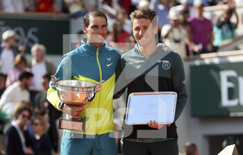 2022-06-05 - Winner Rafael Nadal of Spain, finalist Casper Ruud of Norway during the trophy ceremony of the men's final during day 15 of Roland-Garros 2022, French Open 2022, second Grand Slam tennis tournament of the season on June 5, 2022 at Roland-Garros stadium in Paris, France - TENNIS - ROLAND GARROS 2022 - WEEK 2 - INTERNATIONALS - TENNIS