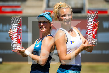 2022-06-19 - Storm Sanders of Australia & Katerina Siniakova of the Czech Republic pose with their trophies after winning the doubles final of the 2022 bett1Open WTA 500 tennis tournament on June 19, 2022 at Rot-Weiss Tennis Club in Berlin, Germany - TENNIS - WTA - 2022 BETT1OPEN - INTERNATIONALS - TENNIS