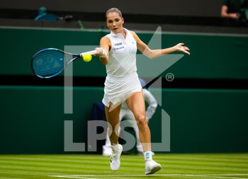 2022-06-27 - Mirjam Bjorklund of Sweden in action against Ons Jabeur of Tunisia during the first round of the 2022 Wimbledon Championships, Grand Slam tennis tournament on June 27, 2022 at All England Lawn Tennis Club in Wimbledon near London, England - TENNIS - WIMBLEDON 2022 - INTERNATIONALS - TENNIS