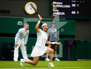 2022-06-27 - Ons Jabeur of Tunisia in action against Mirjam Bjorklund of Sweden during the first round of the 2022 Wimbledon Championships, Grand Slam tennis tournament on June 27, 2022 at All England Lawn Tennis Club in Wimbledon near London, England - TENNIS - WIMBLEDON 2022 - INTERNATIONALS - TENNIS