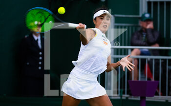 2022-06-27 - Qiang Wang of China in action against Belinda Bencic of Switzerland during the first round of the 2022 Wimbledon Championships, Grand Slam tennis tournament on June 27, 2022 at All England Lawn Tennis Club in Wimbledon near London, England - TENNIS - WIMBLEDON 2022 - INTERNATIONALS - TENNIS