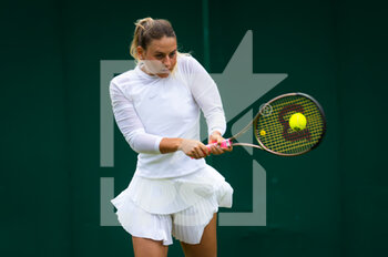 2022-06-29 - Marta Kostyuk of Ukraine in action against Shuai Zhang of China during the second round of the 2022 Wimbledon Championships, Grand Slam tennis tournament on June 29, 2022 at All England Lawn Tennis Club in Wimbledon near London, England - TENNIS - WIMBLEDON 2022 - INTERNATIONALS - TENNIS