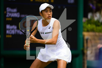 2022-06-29 - Shuai Zhang of China in action against Marta Kostyuk of Ukraine during the second round of the 2022 Wimbledon Championships, Grand Slam tennis tournament on June 29, 2022 at All England Lawn Tennis Club in Wimbledon near London, England - TENNIS - WIMBLEDON 2022 - INTERNATIONALS - TENNIS