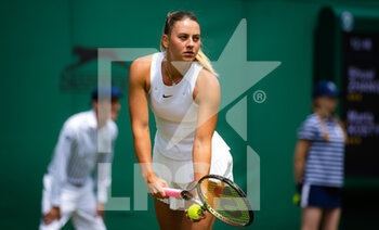 2022-06-29 - Marta Kostyuk of Ukraine in action against Shuai Zhang of China during the second round of the 2022 Wimbledon Championships, Grand Slam tennis tournament on June 29, 2022 at All England Lawn Tennis Club in Wimbledon near London, England - TENNIS - WIMBLEDON 2022 - INTERNATIONALS - TENNIS