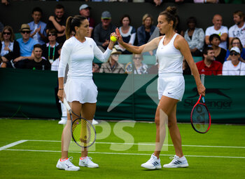 2022-06-29 - Nuria Parrizas Diaz of Spain & Elixane Lechemia of France playing doubles at the 2022 Wimbledon Championships, Grand Slam tennis tournament on June 29, 2022 at All England Lawn Tennis Club in Wimbledon near London, England - TENNIS - WIMBLEDON 2022 - INTERNATIONALS - TENNIS