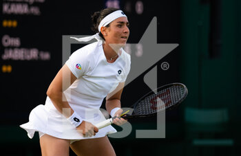 2022-06-29 - Ons Jabeur of Tunisia in action against Katarzyna Kawa of Poland during the second round of the 2022 Wimbledon Championships, Grand Slam tennis tournament on June 29, 2022 at All England Lawn Tennis Club in Wimbledon near London, England - TENNIS - WIMBLEDON 2022 - INTERNATIONALS - TENNIS