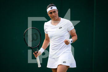 2022-06-29 - Ons Jabeur of Tunisia in action against Katarzyna Kawa of Poland during the second round of the 2022 Wimbledon Championships, Grand Slam tennis tournament on June 29, 2022 at All England Lawn Tennis Club in Wimbledon near London, England - TENNIS - WIMBLEDON 2022 - INTERNATIONALS - TENNIS