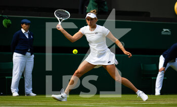 2022-07-01 - Elise Mertens of Belgium in action against Angelique Kerber of Germany during the third round of the 2022 Wimbledon Championships, Grand Slam tennis tournament on July 1, 2022 at All England Lawn Tennis Club in Wimbledon near London, England - TENNIS - WIMBLEDON 2022 - INTERNATIONALS - TENNIS