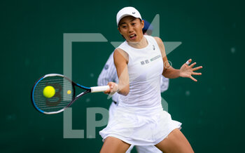 2022-07-01 - Shuai Zhang of China in action against Caroline Garcia of France during the third round of the 2022 Wimbledon Championships, Grand Slam tennis tournament on July 1, 2022 at All England Lawn Tennis Club in Wimbledon near London, England - TENNIS - WIMBLEDON 2022 - INTERNATIONALS - TENNIS