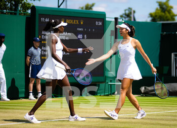 2022-07-04 - Ena Shibahara of Japan & Asia Muhammad of the United States in action during the third round of doubles at the 2022 Wimbledon Championships, Grand Slam tennis tournament on July 4, 2022 at All England Lawn Tennis Club in Wimbledon near London, England - TENNIS - WIMBLEDON 2022 - INTERNATIONALS - TENNIS
