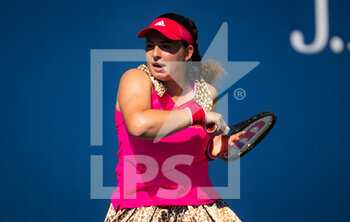 2022-08-30 - Jelena Ostapenko of Latvia in action against Qinwen Zheng of China during the first round of the US Open 2022, Grand Slam tennis tournament on August 30, 2022 at USTA National Tennis Center in New York, United States - TENNIS - US OPEN 2022 - WEEK 1 - INTERNATIONALS - TENNIS