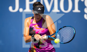 2022-08-30 - Garbine Muguruza of Spain in action against Clara Tauson of Denmark during the first round of the US Open 2022, Grand Slam tennis tournament on August 30, 2022 at USTA National Tennis Center in New York, United States - TENNIS - US OPEN 2022 - WEEK 1 - INTERNATIONALS - TENNIS