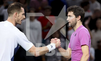 2022-10-31 - Winner Gilles Simon of France (right) shakes hands with Andy Murray of Great Britain during day 1 of the Rolex Paris Masters 2022, ATP Masters 1000 tennis tournament on October 29, 2022 at Accor Arena in Paris, France - TENNIS - ROLEX PARIS MASTERS 2022 - INTERNATIONALS - TENNIS