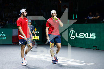 24/11/2022 - Tommy Paul and Jack Sock of United States play doubles against Simone Bolelli and Fabio Fognini of Italy during the third doubles tennis match from Davis Cup Finals 2022, Quarter-Finals round, played between Italy and United States on november 24, 2022 at Palacio de Deportes Martin Carpena pavilion in Malaga, Spain - TENNIS - DAVIS CUP FINALS 2022 - ITALY V UNITED STATES - INTERNAZIONALI - TENNIS