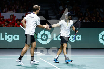24/11/2022 - Kevin Krawietz and Tim Puetz of Germany play doubles against Vasek Pospisil and Denis Shapovalov of Canada during the third doubles tennis match from Davis Cup Finals 2022, Quarter-Finals round, played between Germany and Canada on november 24, 2022 at Palacio de Deportes Martin Carpena pavilion in Malaga, Spain - TENNIS - DAVIS CUP FINALS 2022 - GERMANY V CANADA - INTERNAZIONALI - TENNIS