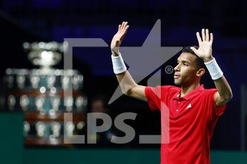 2022-11-26 - Felix Auger-Aliassime of Canada celebrates the victory against Lorenzo Musetti of Italy during the second tennis match from Davis Cup Finals 2022, Semi-Finals round, played between Italy and Canada on november 26, 2022 at Palacio de Deportes Martin Carpena pavilion in Malaga, Spain - TENNIS - DAVIS CUP FINALS 2022 - ITALY V CANADA - INTERNATIONALS - TENNIS