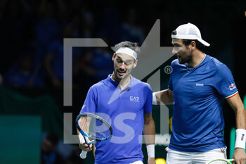 2022-11-26 - Fabio Fognini and Matteo Berretini of Italy play doubles against Felix Auger-Aliassime and Vasek Popisil of Canada during the third doubles tennis match from Davis Cup Finals 2022, Semi-Finals round, played between Italy and Canada on november 26, 2022 at Palacio de Deportes Martin Carpena pavilion in Malaga, Spain - TENNIS - DAVIS CUP FINALS 2022 - ITALY V CANADA - INTERNATIONALS - TENNIS