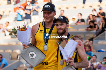 2022-06-19 - Nils Ehlers of Germany and Clemens Wickler of Germany celebrate the victory after the Beach Volleyball , Paris Beach Pro Tour on October 1, 2023 at Roland Garros, Paris, France - BEACH VOLLEYBALL - PARIS BEACH PRO TOUR - BEACH VOLLEY - VOLLEYBALL