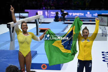 2023-10-08 - Rebeca Andrade (BRA) and Flavia Saraiva (BRA) celebrating the two medal on floor - 52ND ARTISTIC GYMNASTICS WORLD CHAMPIONSHIPS - APPARATUS FINALS DAY 2 - GYMNASTICS - OTHER SPORTS
