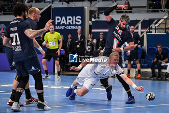 2023-05-17 - Patrick WIENCEK of Kiel and Luka KARABATIC of PSG during the EHF Champions League, Quarter-finals, 2nd leg handball match between Paris Saint-Germain and THW Kiel on May 17, 2023 at Pierre de Coubertin stadium in Paris, France - HANDBALL - CHAMPIONS LEAGUE - PARIS SG V KIEL - HANDBALL - OTHER SPORTS