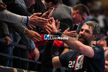 2023-05-17 - Luka KARABATIC of PSG celebrate the victory with supporters during the EHF Champions League, Quarter-finals, 2nd leg handball match between Paris Saint-Germain and THW Kiel on May 17, 2023 at Pierre de Coubertin stadium in Paris, France - HANDBALL - CHAMPIONS LEAGUE - PARIS SG V KIEL - HANDBALL - OTHER SPORTS