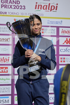 12/02/2023 - Ysaora Thibus (FRA) on the podium with the winner's cup - 2023 FOIL GRAND PRIX - INALPI TROPHY - SCHERMA - ALTRO