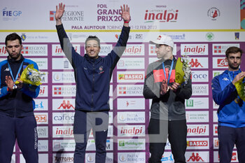12/02/2023 - Gerek Meinhardt (USA) celebrating on the podium beside Filippo Macchi (ITA), Alexander Choupenitch (CZE) and Daniele Garozzo (ITA) - 2023 FOIL GRAND PRIX - INALPI TROPHY - SCHERMA - ALTRO