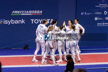 2023-07-28 - Poland team hugs with team Italy - FIE SENIOR FENCING WORLD CHAMPIONSHIPS - DAY7 - FENCING - OTHER SPORTS