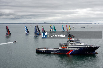 2023-05-07 - Fleet illustration and Abeille Bourbon, intervention, assistance and rescue tug during the start of the Guyader Bermudes 1000 Race 2023, IMOCA Globe Series sailing race on May 7, 2023 in Brest, France - SAILING - GUYADER BERMUDES 1000 RACE 2023 - SAILING - OTHER SPORTS