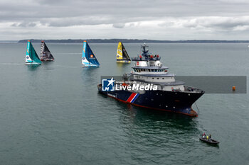 2023-05-07 - Fleet illustration and Abeille Bourbon, intervention, assistance and rescue tug during the start of the Guyader Bermudes 1000 Race 2023, IMOCA Globe Series sailing race on May 7, 2023 in Brest, France - SAILING - GUYADER BERMUDES 1000 RACE 2023 - SAILING - OTHER SPORTS