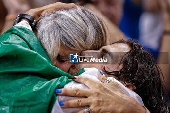 2023-08-22 - Gianmarco Tamberi (ITA) Gold medal with mother Sabrina Piastrellini, Men’s High Jump during the World Athletics Championships 2023 on August 22, 2023 at Nemzeti Atletikai Kozpont in Budapest, Hungary - ATHLETICS - WORLD ATHLETICS CHAMPIONSHIPS 2023 - INTERNATIONALS - ATHLETICS