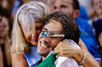 2023-08-22 - Gianmarco Tamberi (ITA) Gold medal with mother Sabrina Piastrellini, Men’s High Jump during the World Athletics Championships 2023 on August 22, 2023 at Nemzeti Atletikai Kozpont in Budapest, Hungary - ATHLETICS - WORLD ATHLETICS CHAMPIONSHIPS 2023 - INTERNATIONALS - ATHLETICS