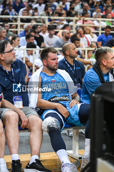 2023-08-04 - 77 LUKA DONCIC of Slovenia injured during the International Friendly match between Greece and Slovenia at OAKA Stadium on August 4, 2023, in Athens, Greece. - GREECE VS SLOVENIA - FRIENDLY MATCH - BASKETBALL