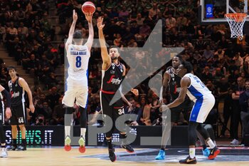 2023-02-19 - Amedeo Della Valle (Germani Brescia) 3 points shoot thwarted by Kyle Weems (Virtus Segafredo Bologna)  - FINAL - VIRTUS SEGAFREDO BOLOGNA VS GERMANI BRESCIA - ITALIAN CUP - BASKETBALL