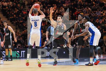 2023-02-19 - Amedeo Della Valle (Germani Brescia) 3 points shoot thwarted by Kyle Weems (Virtus Segafredo Bologna)  - FINAL - VIRTUS SEGAFREDO BOLOGNA VS GERMANI BRESCIA - ITALIAN CUP - BASKETBALL