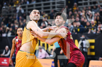 15/03/2023 - 9 PIERRE ORIOLA of AEK BC competing with 22 ANGELO CALOIARO of Galatasaray Nef during the Round of 16, match between AEK BC and Galatasaray Nef at Ano Liossia Olympic Hall on Wednesday 15 March 2023, in Athens, Greece. - AEK BC VS GALATASARAY NEF - CHAMPIONS LEAGUE - BASKET