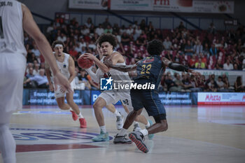 2023-10-11 - Nadir Hifi (Paris Basketball) in action against Jordan Parks (Umana Reyer Venezia) - UMANA REYER VENEZIA VS PARIS BASKETBALL - EUROCUP - BASKETBALL