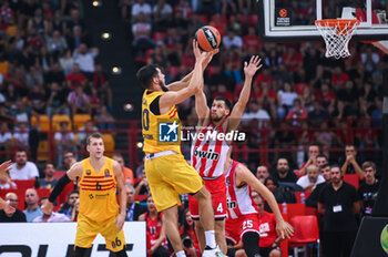 2023-10-13 - 10 Nikola Kalinic of FC Barcelona competing with 4 Michalis Lountzis of Olympiacos Piraeus during the Euroleague, Round 2, match between Olympiacos Piraeus and FC Barcelona at Peace & Friendship Stadium on October 13, 2023, in Athens, Greece. - OLYMPIACOS PIRAEUS VS FC BARCELONA - EUROLEAGUE - BASKETBALL