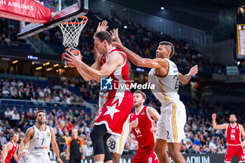 2023-10-19 - Johannes Voigtmann (EA7 Emporio Armani Olimpia Milano) in action against Edy Tavares (Real Madrid) during the basketball game between Real Madrid and EA7 Emporio Armani Olimpia Milano valid for the round 04 of the Euroleague competition played at Wizink Center in Madrid, Spain on Thursday 19 October 2023 - REAL MADRID VS OLIMPIA MILANO - EUROLEAGUE - BASKETBALL