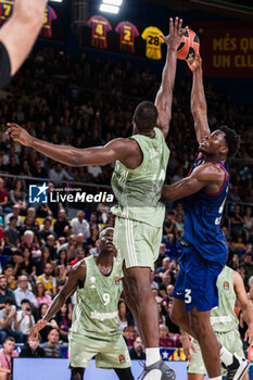 2023-10-20 - James Nnaji of Fc Barcelona in action against Serge Ibaka of FC Bayern Munich during the Turkish Airlines EuroLeague basketball match between FC Barcelona and Bayern Munich on October 20, 2023 at Palau Blaugrana in Barcelona, Spain - BASKETBALL - EUROLEAGUE - FC BARCELONA V BAYERN MUNICH - EUROLEAGUE - BASKETBALL