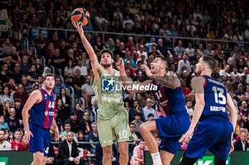 2023-10-20 - Leandro Bolmaro of FC Bayern Munich in action against Willy Hernangomez of Fc Barcelona during the Turkish Airlines EuroLeague basketball match between FC Barcelona and Bayern Munich on October 20, 2023 at Palau Blaugrana in Barcelona, Spain - BASKETBALL - EUROLEAGUE - FC BARCELONA V BAYERN MUNICH - EUROLEAGUE - BASKETBALL