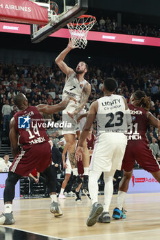 2023-11-23 - Joffrey LAUVERGNE of Lyon and Serge IBAKA of Bayern Munich during the Turkish Airlines EuroLeague basketball match between LDLC Asvel and Bayern Munich on November 23, 2023 at LDLC Arena in Décines-Charpieu near Lyon, France - BASKETBALL - EUROLEAGUE - ASVEL V BAYERN MUNICH - EUROLEAGUE - BASKETBALL