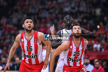 2023-12-05 - 16 Kostas Papanikolaou with 25 Alec Peters of Olympiacos Piraeus competing with 30 Eli Ndiaye of Real Madrid during the Euroleague, Round 12, match between Olympiacos Piraeus and Real Madrid at Peace and Friendship stadium on December 5, 2023, in Piraeus, Greece. - OLYMPIACOS PIRAEUS VS REAL MADRID - EUROLEAGUE - BASKETBALL