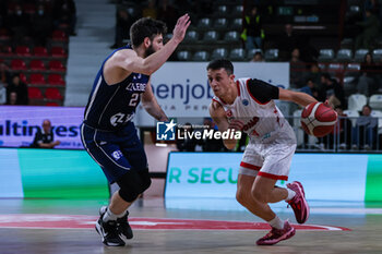 2023-12-13 - Matteo Librizzi #13 of Itelyum Varese (R) competes for the ball against Maarten Bouwknecht #2 of ZZ Leiden (L) during FIBA Europe Cup 2023/24 Second Round Group N game between Itelyum Varese and ZZ Leiden at Itelyum Arena, Varese, Italy on December 13, 2023 - ITELYUM VARESE VS ZZ LEIDEN - FIBA EUROPE CUP - BASKETBALL