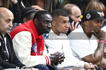 2023-05-16 - Omar Sy and Kylian Mbappe during the French championship, Betclic Elite basketball match between Metropolitans 92 (Boulogne-Levallois) and Paris Basketball on May 16, 2023 at Palais des Sports Marcel Cerdan in Levallois, France - BASKETBALL - FRENCH CHAMP - METROPOLITANS V PARIS - FRENCH PRO A - BASKETBALL