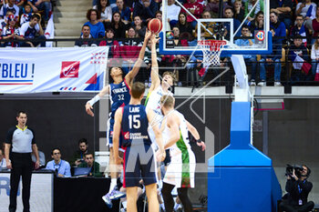 2023-02-26 - Victor WEMBANYAMA (32) of France and Mindaugas KUZMINSKAS (19) of Lithuania during the FIBA Basketball World Cup 2023 Qualifiers between France and Lithuania on February 26, 2023 at Arena Loire in Trelaze, France - BASKETBALL - FIBA BASKETBALL WORLD CUP 2023 QUALIFIERS - FRANCE V LITHUANIA - INTERNATIONALS - BASKETBALL