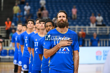 2023-08-09 - Italian National Team during the National Anthem at the Aegean Acropolis Tournament match between Italy and Serbia at Oaka Stadium on August 9, 2023, in Athens, Greece. - AEGEAN ACROPOLIS TOURNAMENT - SERBIA VS ITALY - INTERNATIONALS - BASKETBALL